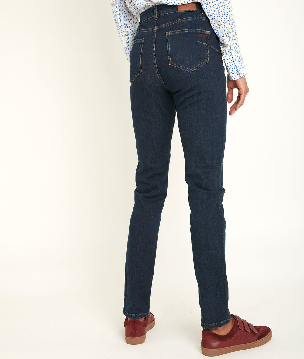 Suzy, the iconic slim-fit raw used jeans raw denim.