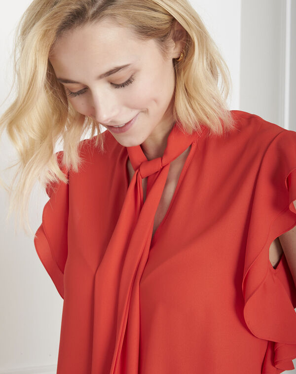 Valina red ruffled blouse with floppy bow tie orange.
