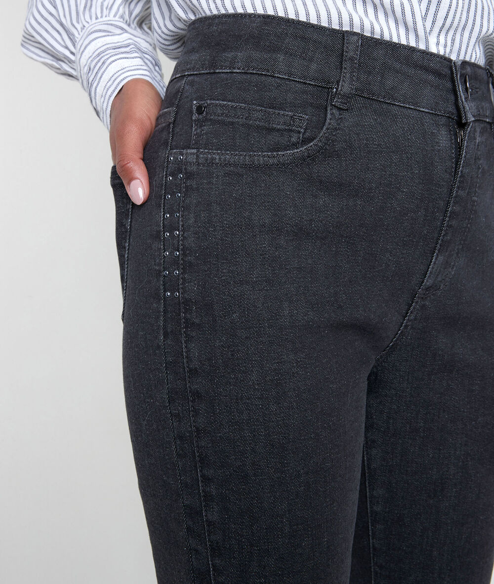 The iconic canelle black studded slim-fit jeans noir.