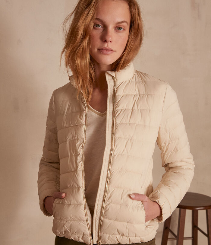 Olivia beige nylon lightweight padded jacket.