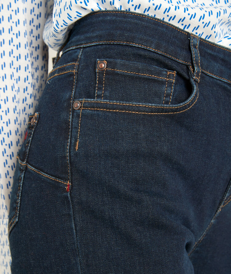 Suzy, the iconic slim-fit raw used jeans raw denim.